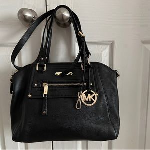 Michael Kors black shoulder,satchel, and crossbody bag.
